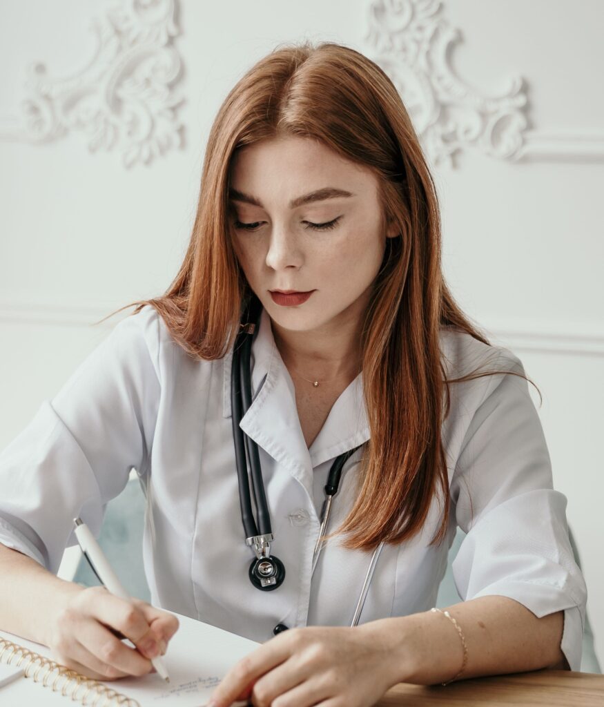 medical billing doctor writing on paper